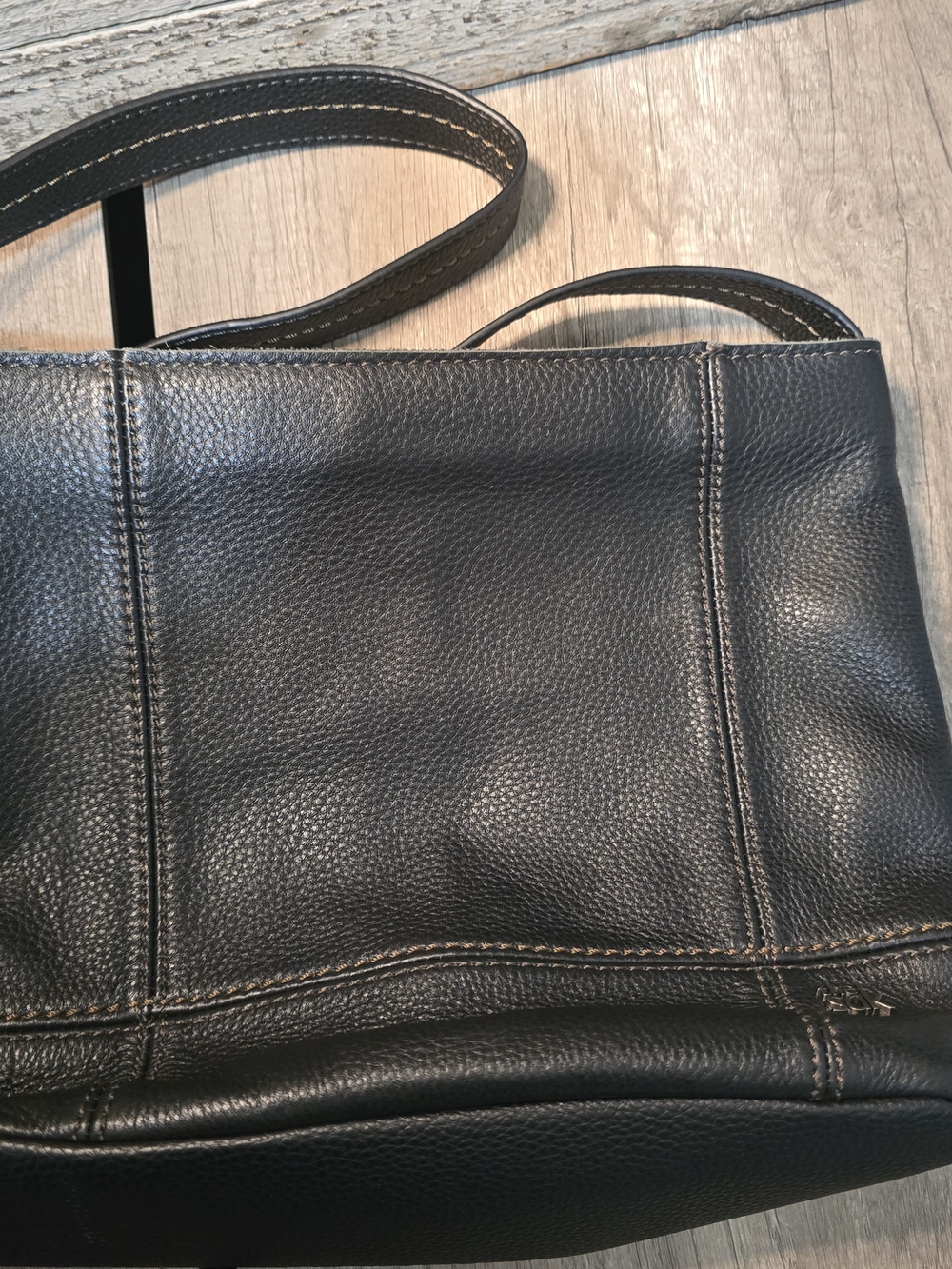 The Sak De Young Hobo crafted in black pebbled leather.